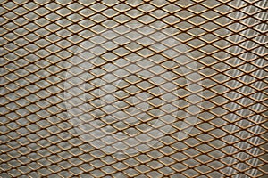 Gold metal steel grating for wall background and texture.