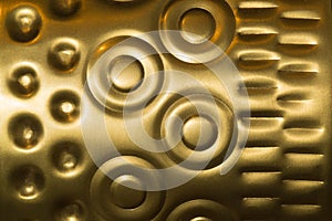 Gold metal texture with golden circles and dots pattern used as background