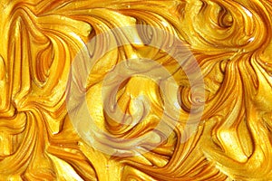 Gold metallic glitter paint swirls