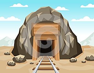 Gold mine entrance with rails in the rock