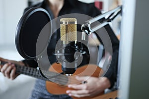 Gold modern professional microphone closeup background