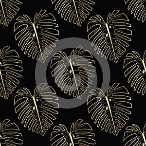 Gold monstera leaf on the black background.