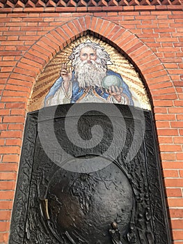 A gold mosaic of God the Father with a White Beard & Holding the Universe in TarnÃ³w, Poland - POLSKA - CATHOLIC