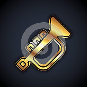 Gold Musical instrument trumpet icon isolated on black background. Vector