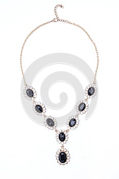 Gold necklace with gems isolated on white