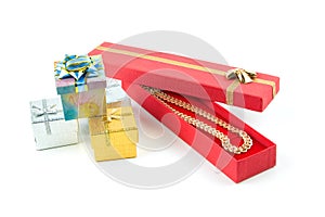 Gold necklace in red box