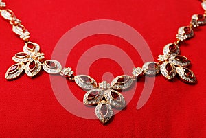 Gold necklace with ruby gem