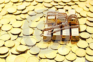 Gold necklaces and have gold bars with stack of coins money on yellow background, Business investment and Saving money for prepare