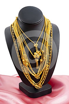 The Gold necklaces on necklace display stand