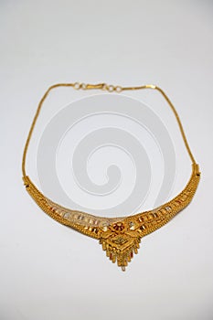 Gold necklaces on white background