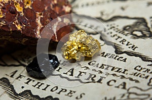 Gold-nugget, coal and bauxite mineral and a map of Africa