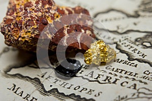 Gold-nugget, coal and bauxite mineral and a map of Africa