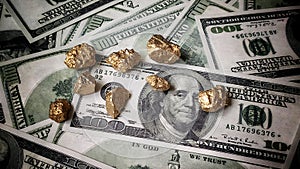 Gold nugget lies on dollars