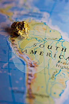 Gold nugget and map of Peru