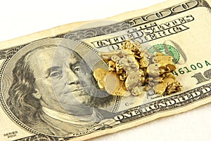 Gold Nuggets And Hundred Dollar Bill