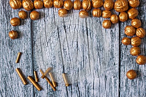 Gold nuts and gilt sticks on the background of old wooden panels, Christmas background