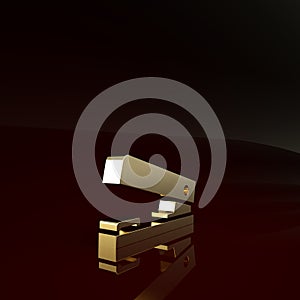 Gold Office stapler icon isolated on brown background. Stapler, staple, paper, cardboard, office equipment. Minimalism