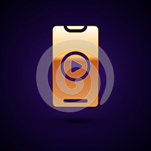 Gold Online play video icon isolated on black background. Smartphone and film strip with play sign. Vector Illustration