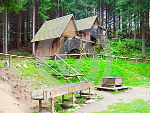 Gold ore mills. Medieval wooden water mills in Zlate Hory, Czech Republic photo