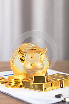 Gold and other precious metals and Taurus piggy bank