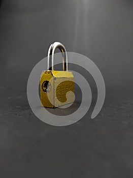 Gold padlock on black - stock photo