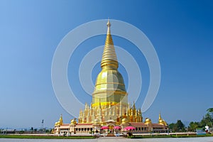 The gold pagoda under clear sky