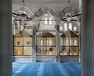 Gold painted decorated Interleaved wooden windows Mashrabiya inside three marble arches, Nuruosmaniye Mosque, Istanbul, Turkey photo