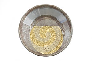 A gold pan filled with natural placer gold photo