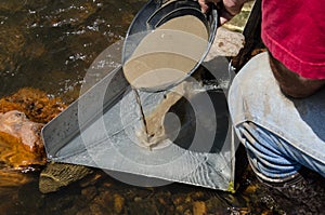 Gold panning with sluice box