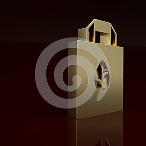 Gold Paper shopping bag with recycle icon isolated on brown background. Bag with recycling symbol. Minimalism concept
