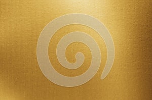 Gold paper texture background. Golden metallic blank paper sheet surface with light reflection