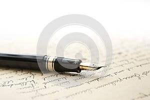 Gold Pen with Letter and Writing