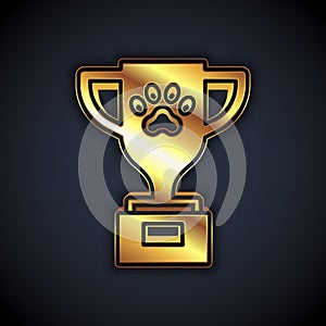 Gold Pet award symbol icon isolated on black background. Medal with dog footprint as pets exhibition winner concept