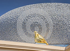 Gold pigeon on the roof of Museum De Fundatie in Zwolle