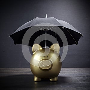 Gold Piggy bank with umbrella concept for finance insurance, protection, safe investment or banking