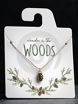 Gold Pinecone Jewelry on Board.  Wander in the Woods photo