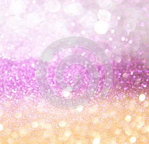 Gold and pink abstract bokeh lights. defocused background