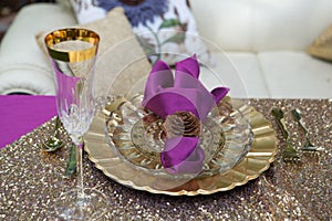 Gold Place setting with a pine cone napkin ring
