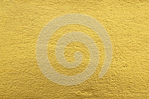 gold plaster wall texture background or wall foil texture