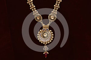 Gold plated jewelry - Fancy Designer golden chain pendant neck-set closeup macro image