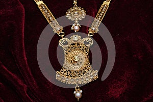 Gold plated jewelry -Fancy Designer golden long pendant set with head accessory closeup macro image