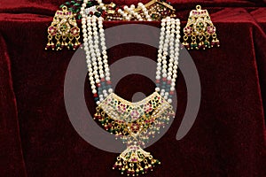 Gold plated jewelry - Fancy Designer golden and pearl `Jadau`neck-set with earrings closeup macro image