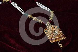 Gold plated jewelry -Fancy Designer golden pendant-set with pearls closeup macro image