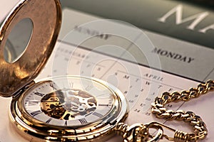 Gold pocket watch and calendar