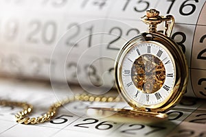 Gold pocket watch and calendar