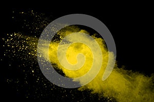 Gold powder particles explosion. Glitter burst with golden texture. Yellow color dust splash for fashion background