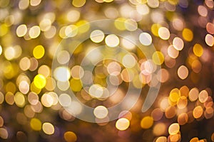 Gold and purple abstract bokeh or defocused background glittering stars for christmas and new year event