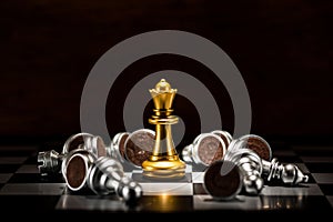 Gold queen chess surrounded by a number of fallen silver chess p