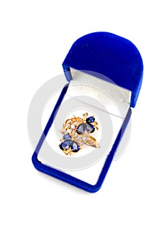 Gold ring with blue sapphires and cubic zirkonia in gift box