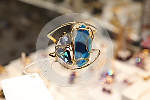 Gold ring with blue stone